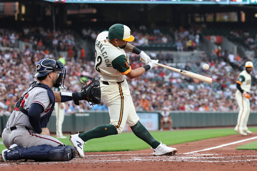 Baltimore Orioles' Christian Encarnacion-Strand hits a double off Atlanta Braves pitcher Grant Holmes which scored Leody Taveras and Jackson Holliday during the second inning of a baseball game, Friday, July 24, 2026, in Baltimore. (AP Photo/Terrance Williams)