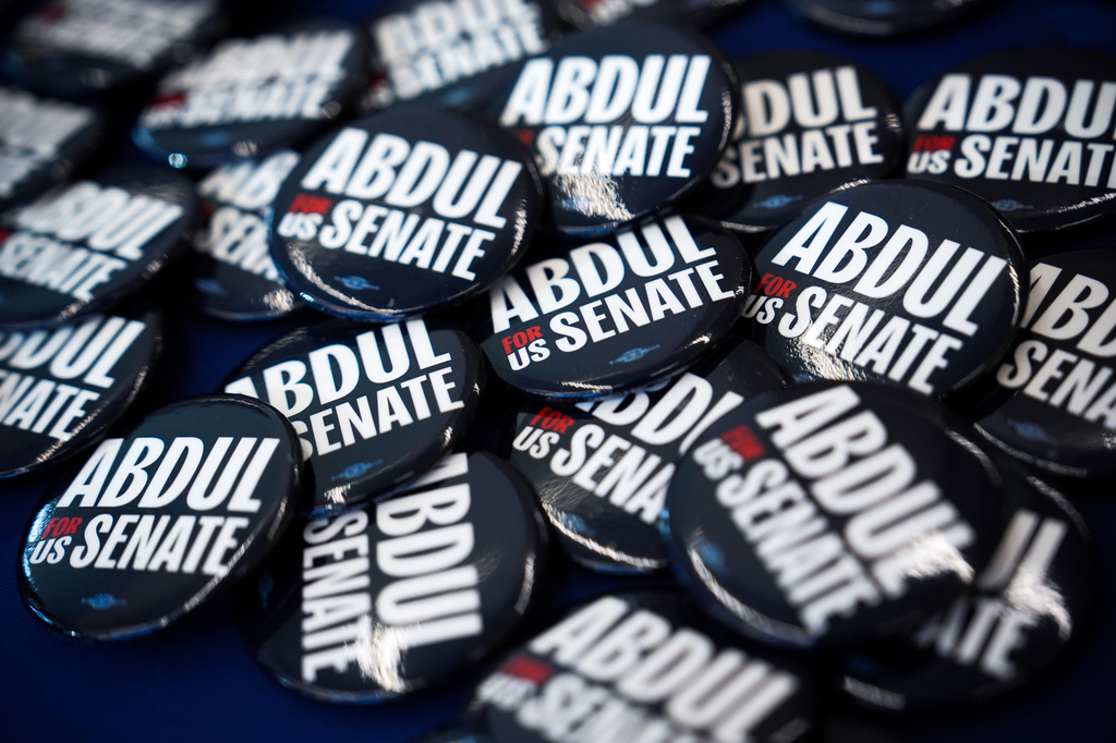 Buttons lay on a table before a campaign event with streamer Hasan Piker and Abdul El-Sayed, a progressive candidate in the Democratic primary for U.S. Senate in Michigan, Tuesday, April 7, 2026, at the University of Michigan in Ann Arbor, Mich. (AP Photo/Julia Demaree Nikhinson)
