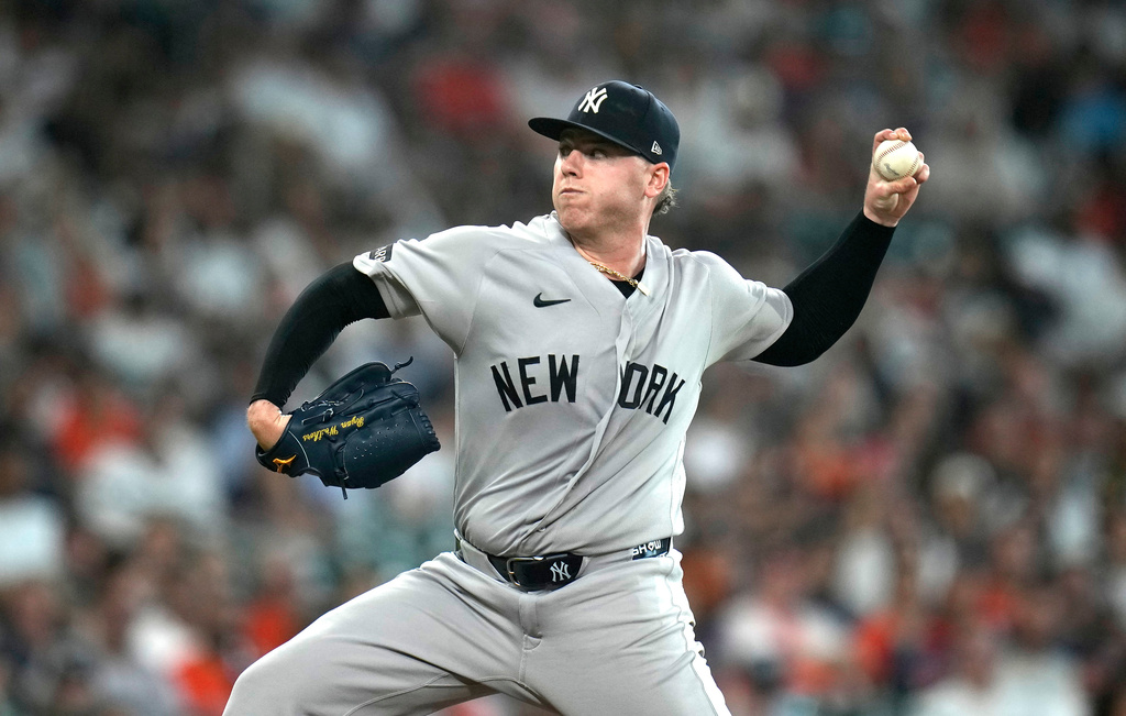 New York Yankees starting pitcher Ryan Weathers delivers to Houston Astros' Isaac Paredes during the first inning of a baseball game, Saturday, April 25, 2026, in Houston. (AP Photo/Karen Warren)