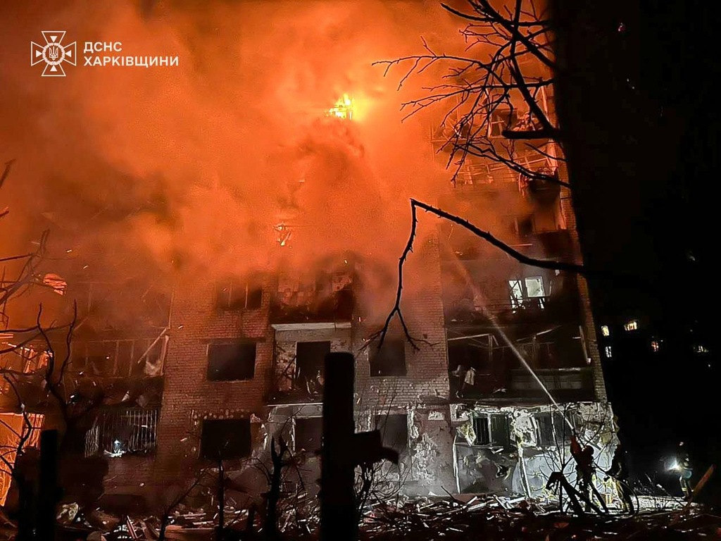 In this photo provided by the Ukrainian Emergency Service, emergency services personnel work to extinguish a fire following a Russian attack in Balakliya, Kharkiv region, Ukraine, Monday, Nov. 17, 2025. (Ukrainian Emergency Service via AP)