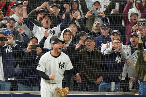 New York Yankees fans react as New York Yankees third baseman Ryan McMahon makes a catch for the final out against the Boston Red Sox to win Game 3 of an American League wild-card baseball playoff series, Thursday, Oct. 2, 2025, in New York. (AP Photo/Frank Franklin II) New York Yankees fans react as New York Yankees third baseman Ryan McMahon makes a catch for the final out against the Boston Red Sox to win Game 3 of an American League wild-card baseball playoff series, Thursday, Oct. 2, 2025, in New York. (AP Photo/Frank Franklin II)