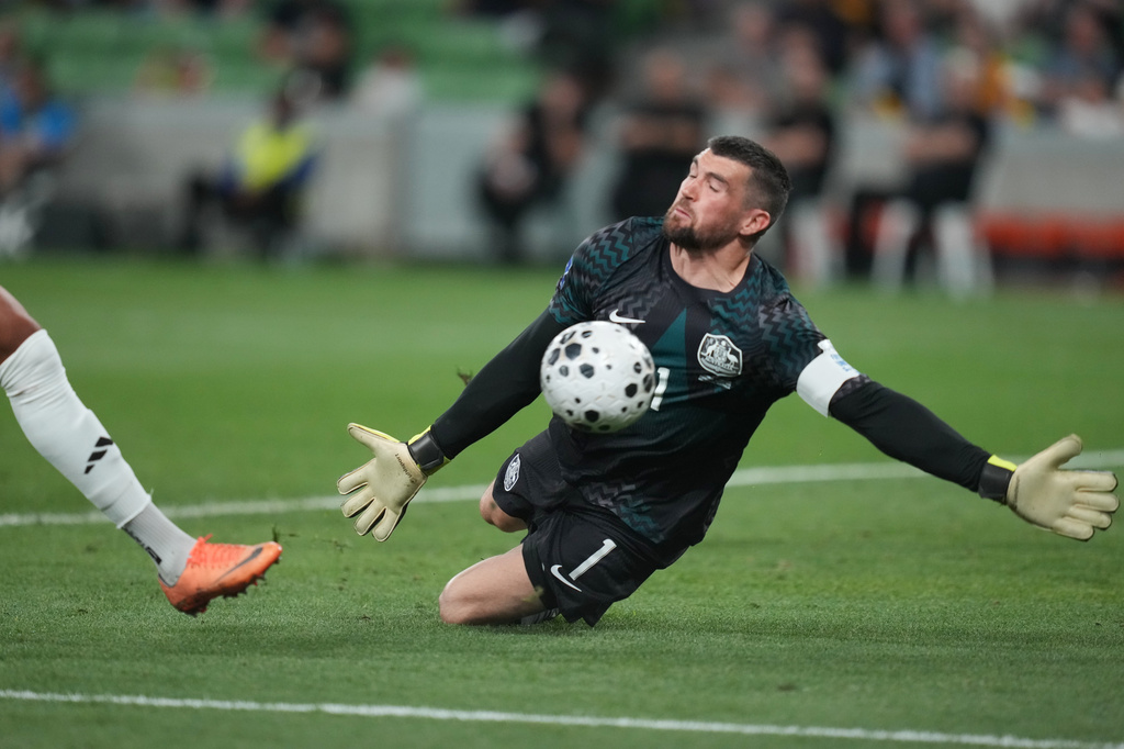FILE - Australia's goalkeeper Matthew Ryan makes a save during their international soccer friendly against Curacao in Melbourne, Australia, Tuesday, March 31, 2026. (AP Photo/Asanka Brendon Ratnayake)