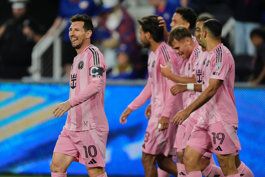 Inter Miami CF midfielder Lionel Messi, left, celebrates after scoring a goal during the second half of an MLS soccer game Wednesday, May 13, 2026, in Cincinnati. (AP Photo/Joshua A. Bickel)