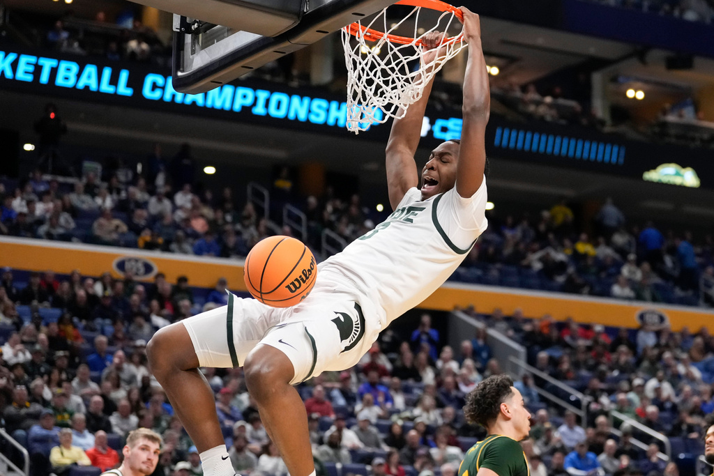 Michigan State forward Cameron Ward (3) dunks against North Dakota State during the second half in the first round of the NCAA college basketball tournament, Thursday, March 19, 2026, in Buffalo, N.Y. (AP Photo/Yuki Iwamura)