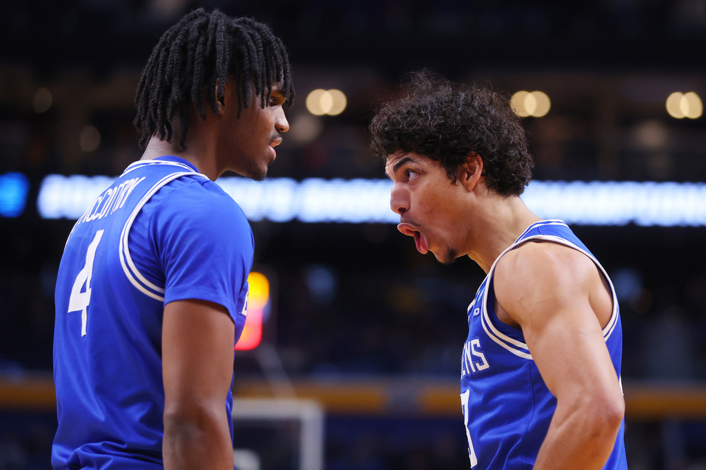 Saint Louis guard Amari McCottry, left, and guard Dion Brown celebrate during the second half in the first round of the NCAA college basketball tournament against Georgia, Thursday, March 19, 2026, in Buffalo, N.Y. (AP Photo/Jeffrey T. Barnes)