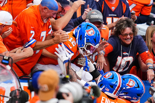 Denver Broncos running back RJ Harvey (12) celebrates with teammates and fans after scoring a touchdown in the second half of an NFL football game against the Dallas Cowboys Sunday, Oct. 26, 2025, in Denver. (AP Photo/Jack Dempsey) Denver Broncos running back RJ Harvey (12) celebrates with teammates and fans after scoring a touchdown in the second half of an NFL football game against the Dallas Cowboys Sunday, Oct. 26, 2025, in Denver. (AP Photo/Jack Dempsey)