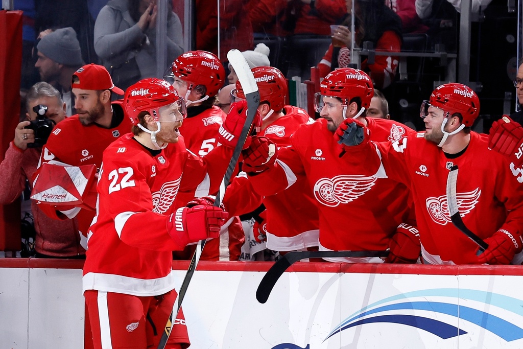 Detroit Red Wings center Mason Appleton (22) celebrates his goal against the Winnipeg Jets with teammates during the first period of an NHL hockey game, Wednesday, Dec. 31, 2025, in Detroit. (AP Photo/Duane Burleson)