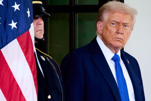 President Donald Trump waits to greet Canada's Prime Minister Mark Carney, as Carney arrives at the White House, Tuesday, Oct. 7, 2025, in Washington. (AP Photo/Jacquelyn Martin) President Donald Trump waits to greet Canada's Prime Minister Mark Carney, as Carney arrives at the White House, Tuesday, Oct. 7, 2025, in Washington. (AP Photo/Jacquelyn Martin)