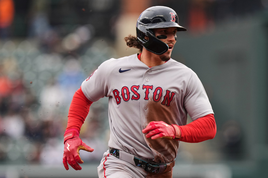 Boston Red Sox's Jarren Duran advances to third base on a wild pitch by Baltimore Orioles starting pitcher Kyle Bradish during the third inning of a baseball game, Sunday, April 26, 2026, in Baltimore. (AP Photo/Stephanie Scarbrough)