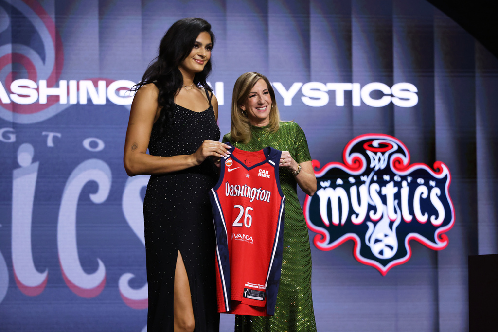 UCLA center Lauren Betts poses with WNBA commissioner Cathy Engelbert after being selected fourth overall by the Washington Mystics in the first round of the WNBA basketball draft Monday, April 13, 2026, in New York. (AP Photo/Pamela Smith)