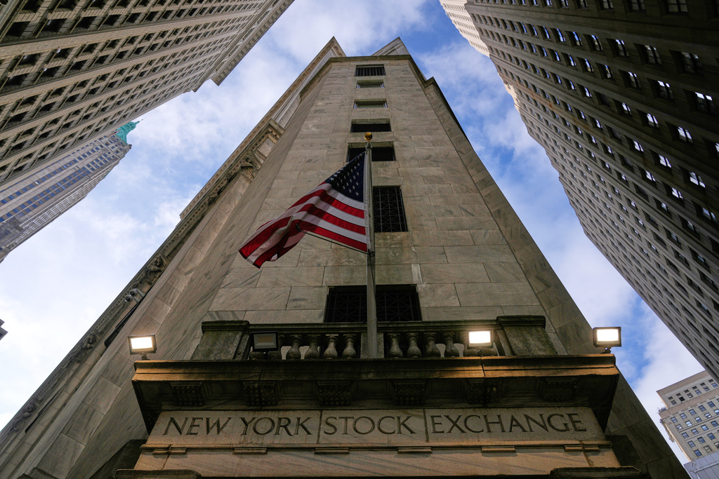 An American flag is displayed over an entrance to the New York Stock Exchange in New York, Thursday, Feb. 12, 2026. (AP Photo/Seth Wenig)