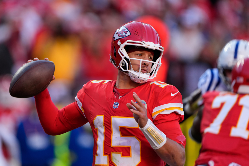 Kansas City Chiefs quarterback Patrick Mahomes (15) throws against the Indianapolis Colts during the second half of an NFL football game Sunday, Nov. 23, 2025, in Kansas City, Mo. (AP Photo/Charlie Riedel)