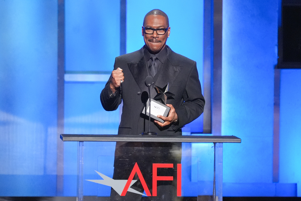 Eddie Murphy accepts the 51st AFI Life Achievement Award during a tribute to him on Saturday, April 18, 2026, at the Dolby Theatre in Los Angeles. (AP Photo/Chris Pizzello)
