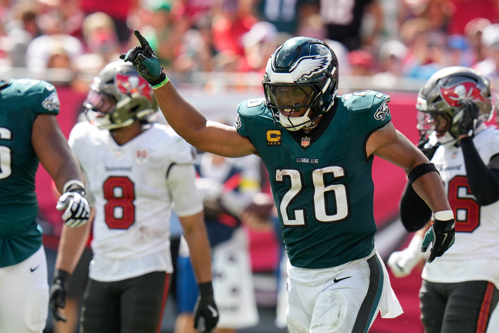 Philadelphia Eagles running back Saquon Barkley (26) celebrates after scoring a touchdown during the second half of an NFL football game against the Tampa Bay Buccaneers, Sunday, Sept. 28, 2025, in Tampa, Fla. (AP Photo/Chris O'Meara)