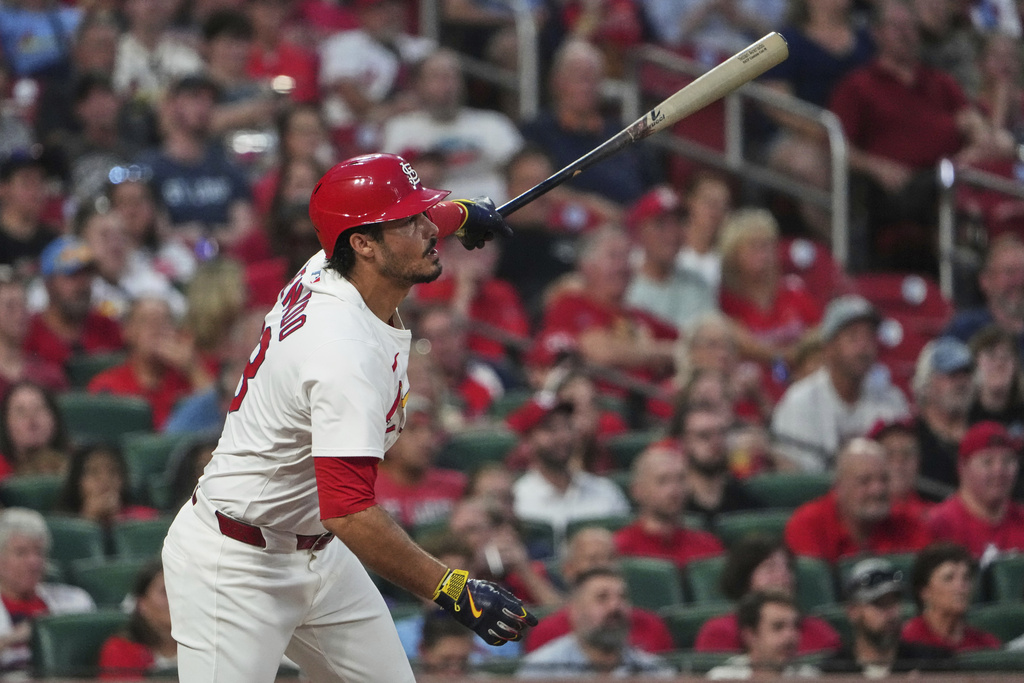 St. Louis Cardinals' Nolan Arenado follows through on an RBI single during the second inning of a baseball game against the Cincinnati Reds Monday, Sept. 15, 2025, in St. Louis. (AP Photo/Jeff Roberson)
