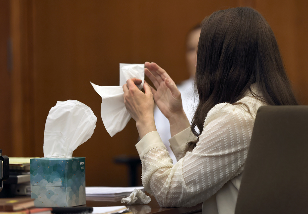 Lindsay Clancy grabs a tissue after witness Elaine Rossi, the nanny to the Clancy children, testified during her murder trial at Plymouth Superior Court in Plymouth, Mass., Wednesday, Aug. 5, 2026. (David L Ryan/The Boston Globe via AP, Pool) CORRECTION: Source is The Boston Globe, not The Boston Herald.