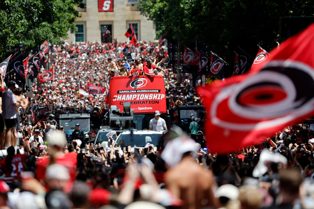 Carolina Hurricanes parade proceeds down Fayetteville Street during the Stanley Cup Championship celebration in Raleigh, N.C., Saturday, June 20, 2026. (AP Photo/Karl DeBlaker)