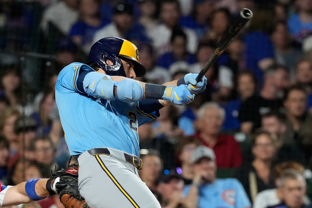 Milwaukee Brewers' Christian Yelich hits a one-run double during the sixth inning of a baseball game against the Chicago Cubs in Chicago, Monday, May 18, 2026. (AP Photo/Nam Y. Huh)