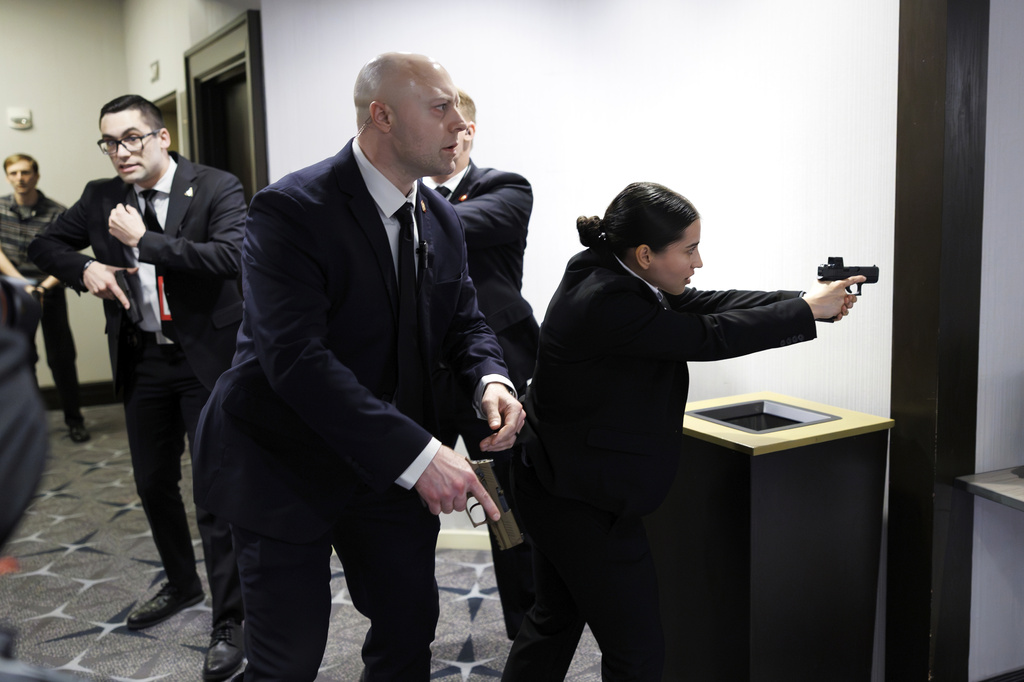Members of law enforcement respond during the White House Correspondents Dinner, Saturday, April 25, 2026, in Washington. (AP Photo/Tom Brenner)
