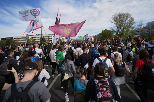 People gather, among them students, to walk on the street towards the northern city of Novi Sad, for a huge rally on Nov. 1 marking the first anniversary of a train station disaster that killed 16 people, in Belgrade, Serbia, Thursday, Oct. 30, 2025. (AP Photo/Darko Vojinovic) People gather, among them students, to walk on the street towards the northern city of Novi Sad, for a huge rally on Nov. 1 marking the first anniversary of a train station disaster that killed 16 people, in Belgrade, Serbia, Thursday, Oct. 30, 2025. (AP Photo/Darko Vojinovic)