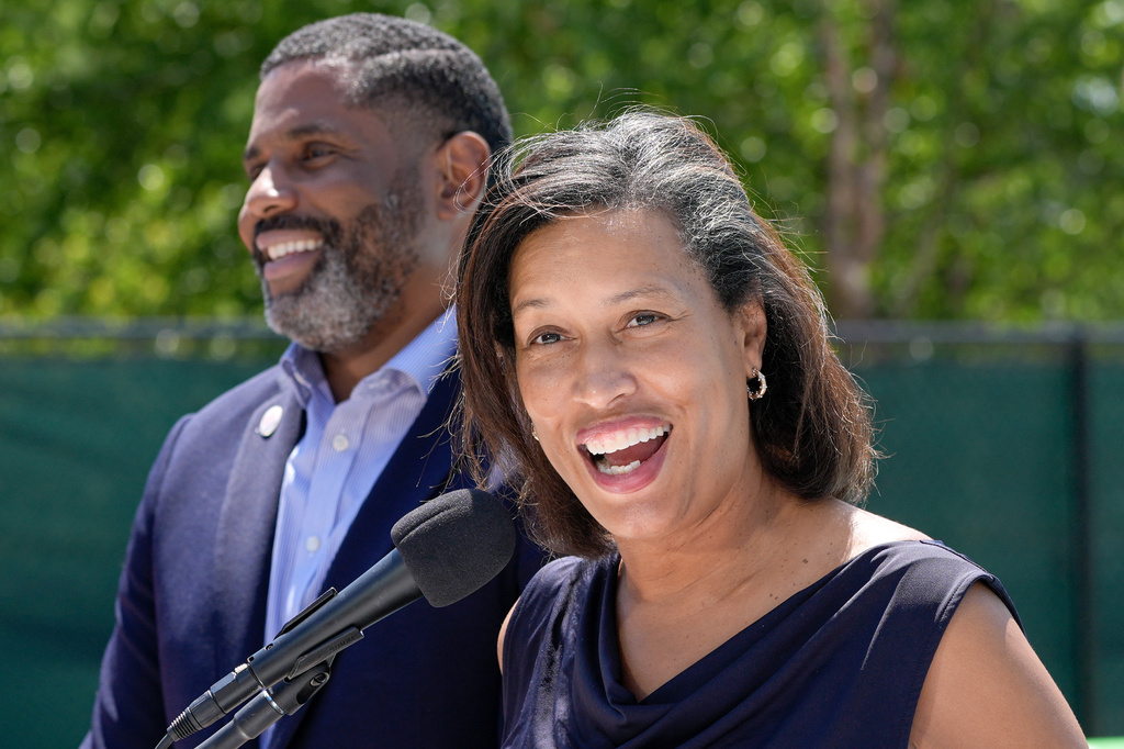 District of Columbia Mayor Muriel Bowser, right, speaks as Delano Hunter, director of the DC Department of General Services, left, listens during the opening of the newly renovated outdoor pool at the Rosedale Recreation Center, Thursday, July 23, 2026, in Washington. (AP Photo/Mariam Zuhaib)