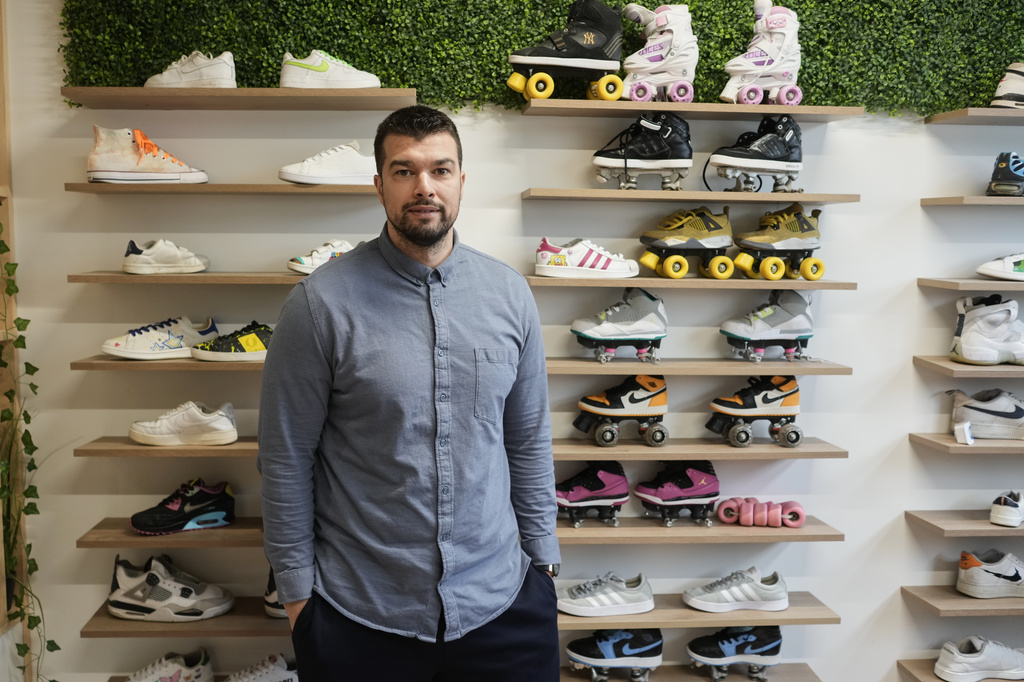 Mohamed Boukhatem, co-founder and director of SneakCoeurZ, a nonprofit organization giving used footwear a second life, poses in Champs-sur-Marne, east of Paris, Wednesday, March 25, 2026. (AP Photo/Thibault Camus)