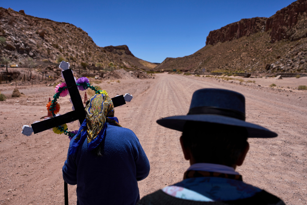 FILE - Cipriana Soriano, right, and Mercedes Soriano return to their home after visiting the tomb of their loved ones during Day of the Dead celebrations in Susques, Argentina, Nov. 1, 2025. (AP Photo/Rodrigo Abd, File)