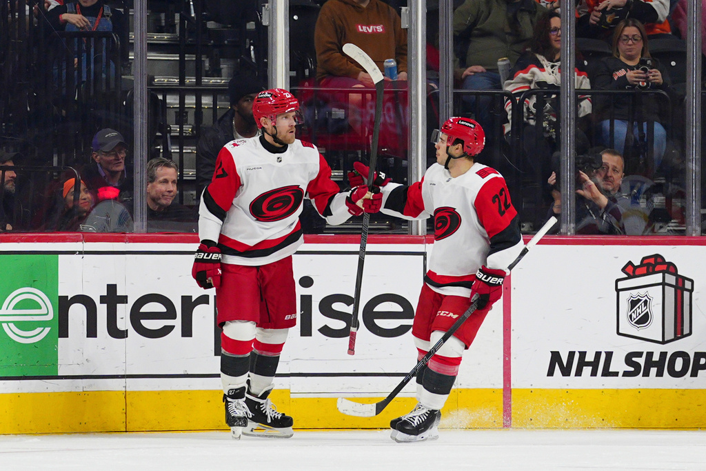 Carolina Hurricanes' Nikolaj Ehlers, left, celebrates his goal with Logan Stankoven (22) during the second period of an NHL hockey game Philadelphia Flyers, Saturday, Dec. 13, 2025, in Philadelphia. (AP Photo/Derik Hamilton)