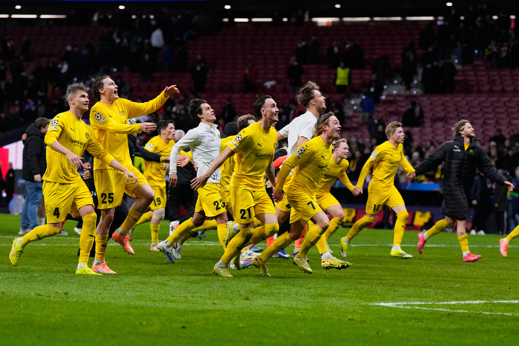 Bodo Glimt players celebrate at the end of the Champions League opening phase soccer match between Atletico Madrid and Bodo Glimt in Madrid, Spain, Wednesday, Jan. 28, 2026. (AP Photo/Manu Fernandez)