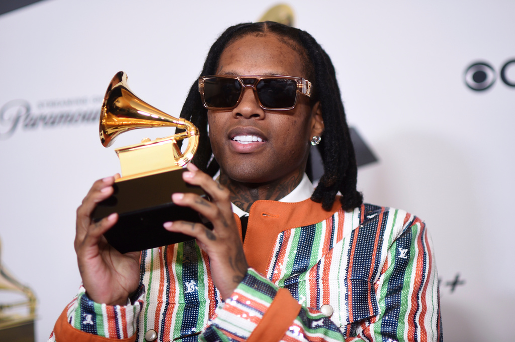 FILE - Lil Durk poses for a photo in the press room with the award for best melodic rap performance for "All My Life" by Lil Durk featuring J. Cole during the 66th annual Grammy Awards, Feb. 4, 2024, in Los Angeles. (Photo by Richard Shotwell/Invision/AP, File)