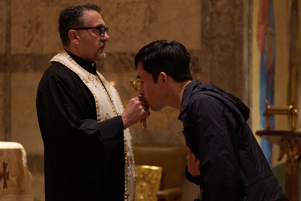 A person kisses the cross during service at St. Sophia Greek Orthodox Cathedral Tuesday, Nov. 18, 2025, in Los Angeles. (AP Photo/Allison Dinner)