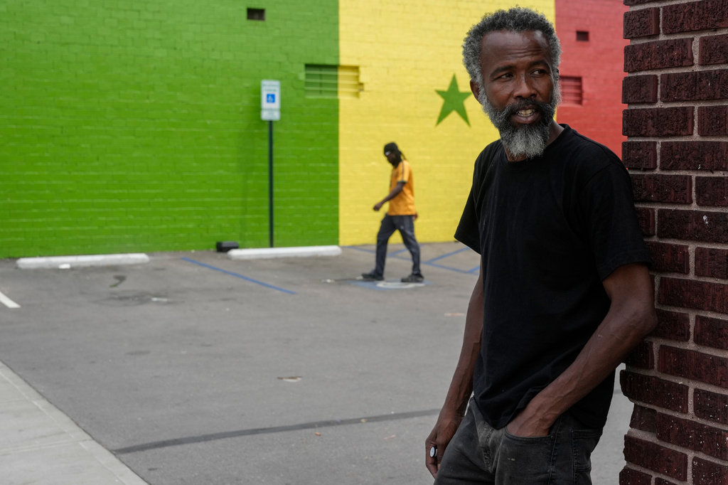 Moussa Sow, a Mauritanian immigrant, stands at the parking lot of Touba Tedoungal African restaurant in Lockland, Ohio, Friday, July 31, 2026. (AP Photo/Carolyn Kaster)