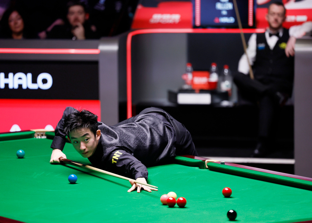 China's Wu Yize in action, during his semi-final match against Northern Ireland's Mark Allen on day fifteen of the World Snooker Championship 2026, in Sheffield, England, Saturday May 2, 2026. (Richard Sellers/PA via AP)