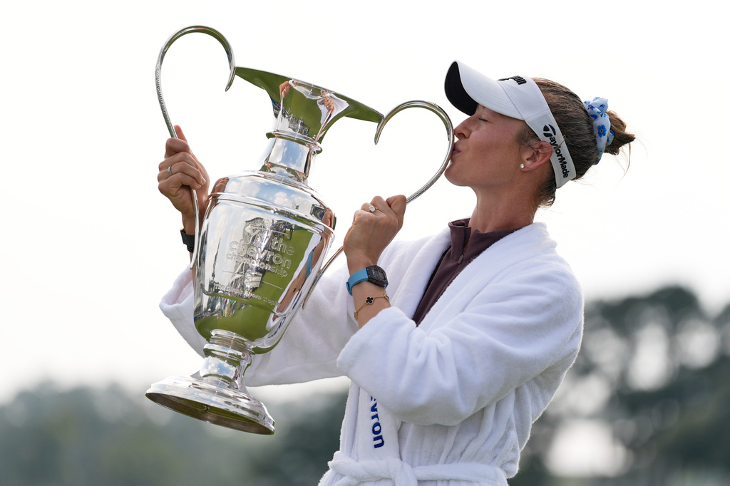 Nelly Korda poses with the trophy after winning the Chevron Championship LPGA golf tournament Sunday, April 26, 2026, in Houston. (AP Photo/Ashley Landis)
