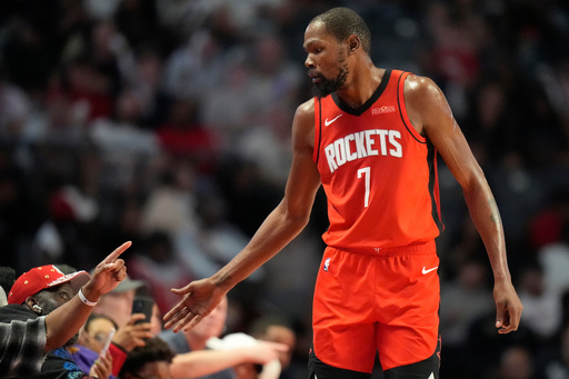 Houston Rockets forward Kevin Durant (7) greets fans during the second half of an NBA preseason basketball game against the New Orleans Pelicans, Tuesday, Oct. 14, 2025, in Birmingham, Ala. (AP Photo/Mike Stewart) Houston Rockets forward Kevin Durant (7) greets fans during the second half of an NBA preseason basketball game against the New Orleans Pelicans, Tuesday, Oct. 14, 2025, in Birmingham, Ala. (AP Photo/Mike Stewart)