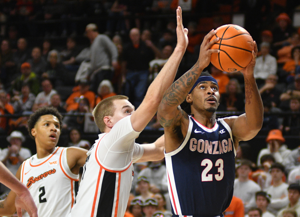 Gonzaga guard Adam Miller (23) shoots in front of Oregon State forward Olavi Suutela (37) during an NCAA college basketball game Saturday, Feb. 7, 2026, in Corvallis, Ore. (AP Photo/Mark Ylen)