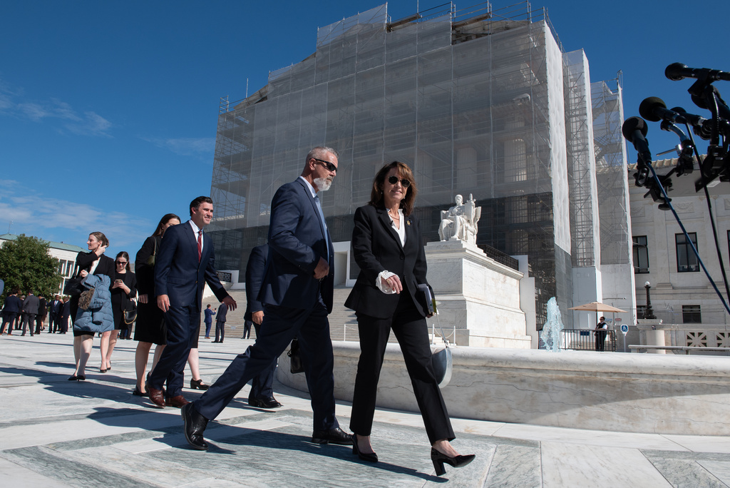 Louisiana Attorney General Liz Murrill, right, leaves the Supreme Court after giving arguments in the case drawing new congressional district boundaries, Wednesday, Oct. 15, 2025, in Washington. (AP Photo/Cliff Owen)