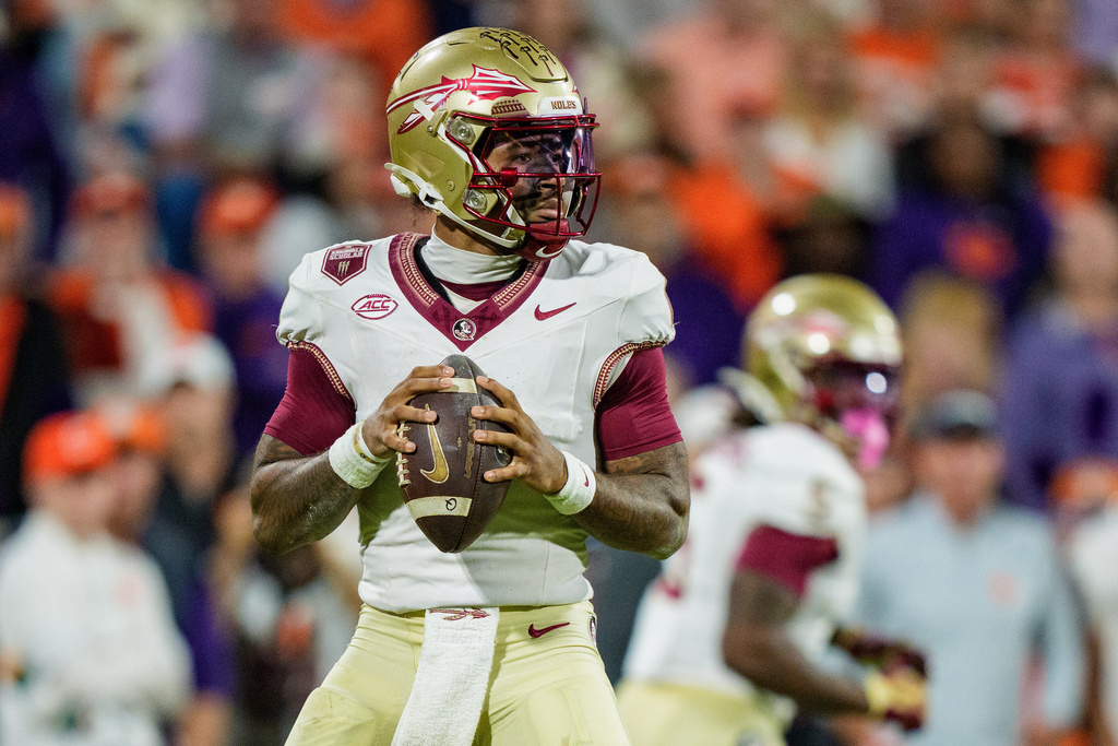 Florida State quarterback Tommy Castellanos (1) drops back to pass in the first half of an NCAA college football game against Clemson, Saturday, Nov. 8, 2025, in Clemson, S.C. (AP Photo/Jacob Kupferman)