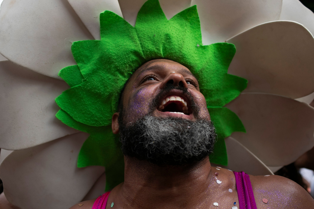 A reveler smiles during the "Ceu na Terra" or "Heaven on Earth" pre-Carnival street party, in Rio de Janeiro, Saturday, Feb. 7, 2026. (AP Photo/Bruna Prado)