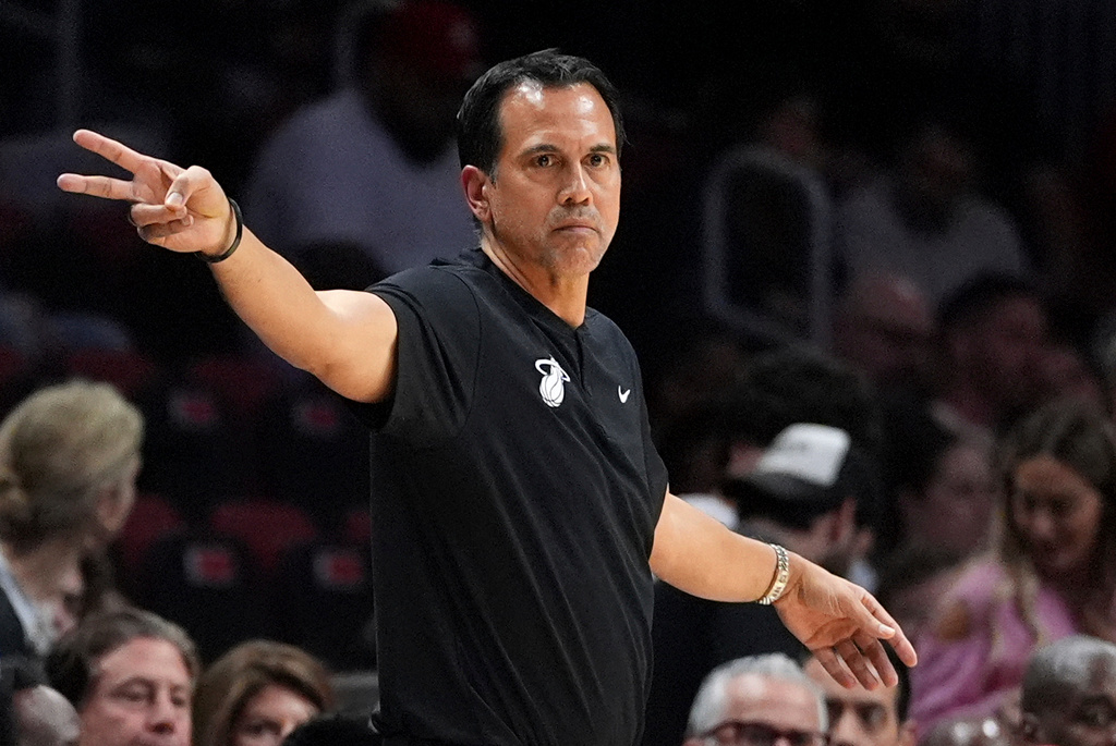 Miami Heat head coach Erik Spoelstra gestures from courtside during the first half of an NBA basketball game against the Phoenix Suns, Tuesday, Jan. 13, 2026, in Miami. (AP Photo/Rebecca Blackwell)