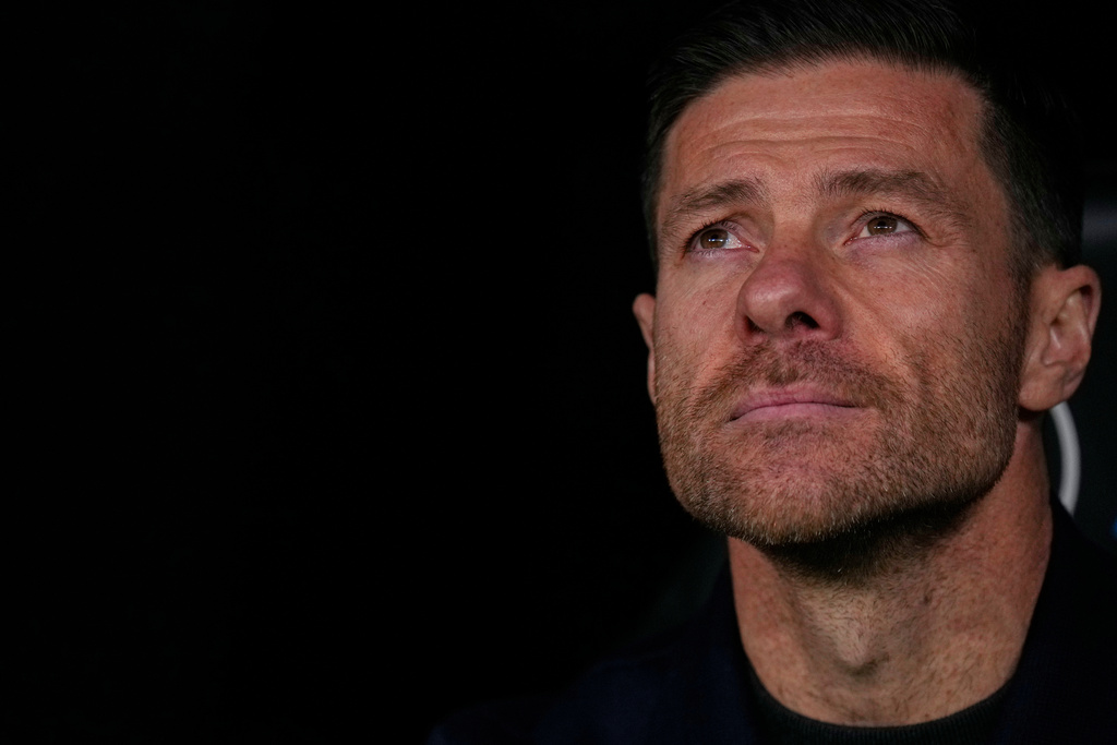 Real Madrid's head coach Xabi Alonso looks out from the dugout ahead of the Spanish La Liga soccer match between Real Madrid and Sevilla in Madrid, Spain, Saturday, Dec. 20, 2025. (AP Photo/Manu Fernandez)