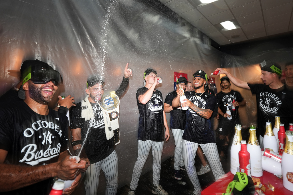 The New York Yankees celebrate after they clinched playoff berth a baseball game against the Chicago White Sox Tuesday, Sept. 23, 2025, in New York. (AP Photo/Frank Franklin II)