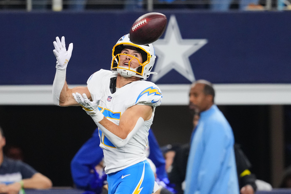 Los Angeles Chargers wide receiver Ladd McConkey (15) makes a touchdown catch during the first half of an NFL football game against the Dallas Cowboys, Sunday, Dec. 21, 2025, in Arlington, Texas. (AP Photo/Julio Cortez)