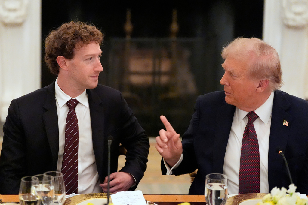FILE - President Donald Trump speaks to Facebook CEO Mark Zuckerberg during a dinner in the State Dining Room of the White House, Sept. 4, 2025, in Washington. (AP Photo/Alex Brandon, File)
