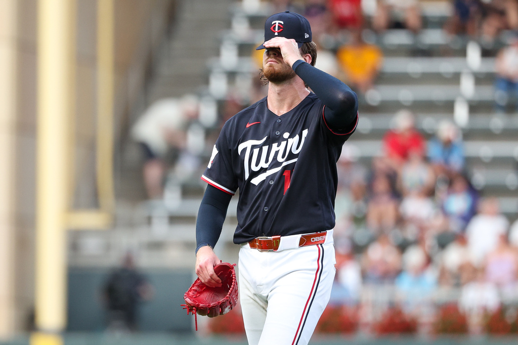 Minnesota Twins starting pitcher Bailey Ober reacts after giving up a two run home run to Baltimore Orioles' Gunnar Henderson during the first inning of a baseball game, Tuesday, Aug. 11, 2026, in Minneapolis. (AP Photo/Matt Krohn)