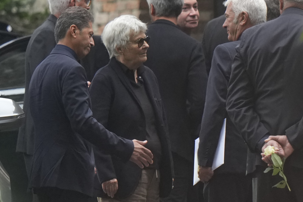 Rossana Armani, center, leaves at the end of her brother, designer Giorgio Armani's funeral at the San Martino church in the small historic village of Rivalta, some 15 kilometers south of Piacenza, northern Italy, Monday, Sept. 8, 2025. (AP Photo/Luca Bruno)