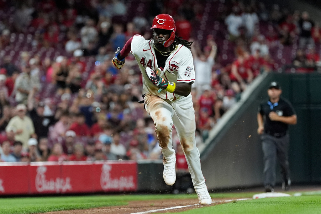 Cincinnati Reds shortstop Elly De La Cruz runs to home plate to score on a wild pitch by Athletics pitcher Hogan Harris in the eighth inning of a baseball game in Cincinnati, Tuesday, Aug. 4, 2026. (AP Photo/Carolyn Kaster)