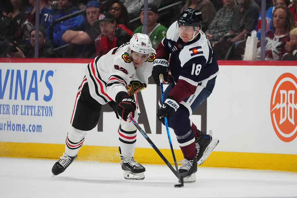 Chicago Blackhawks right wing Ilya Mikheyev, left, tries to block a pass by Colorado Avalanche center Jack Drury in the second period of an NHL hockey game Saturday, Feb. 28, 2026, in Denver. (AP Photo/David Zalubowski)