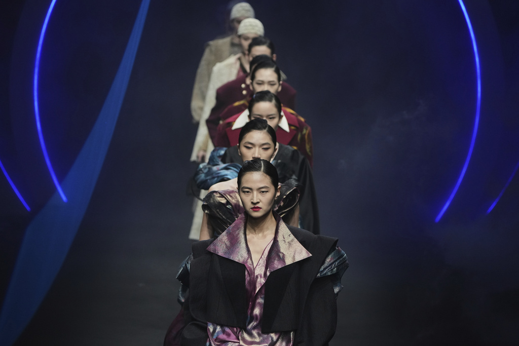 Models present a Dongfang Cup 2024 China Womenswear Design Competition Excellent Works by local designers during the SS2026 China Fashion Week, in Beijing, Monday, Sept. 8, 2025. (AP Photo/Andy Wong)