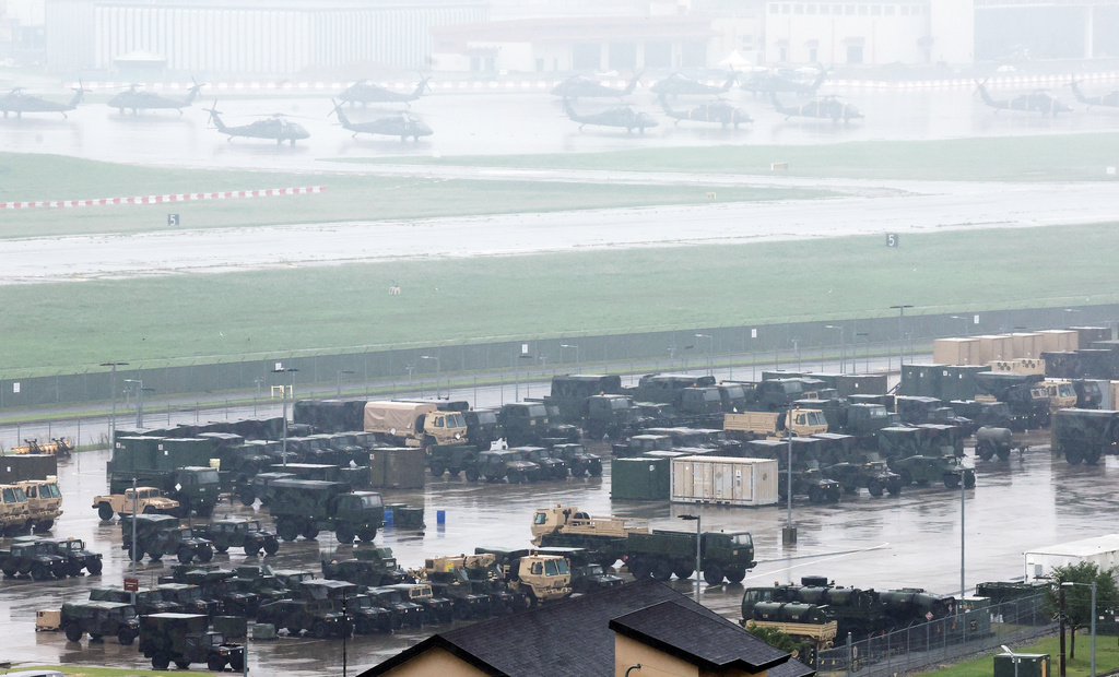 U.S. military vehicles and Black Hawk helicopters are parked at Camp Humphreys in Pyeongtaek, South Korea, Friday, Aug. 21, 2026. (Hong Ki-won/Yonhap via AP)